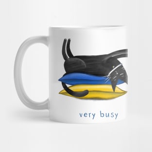 Cartoon black cat on soft pillows and the inscription "Very busy". Mug